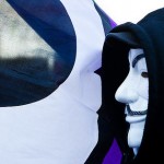 Pirate Party flag with anonymous masked person in front in profile