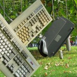 Keyboards and computer mouses hanging from trees