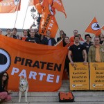 A group of Swiss Pirates with banners and flags