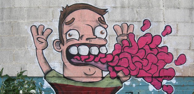 Graffiti of man vomiting